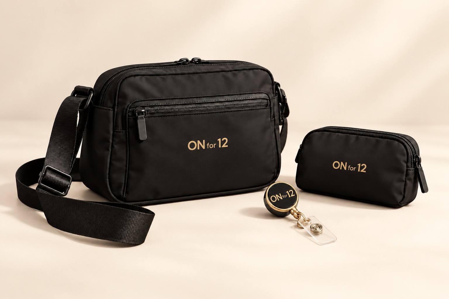 ON for 12 black crossbody bag, pouch, and gold-accented badge reel on a warm ivory background